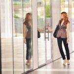 business woman exiting building